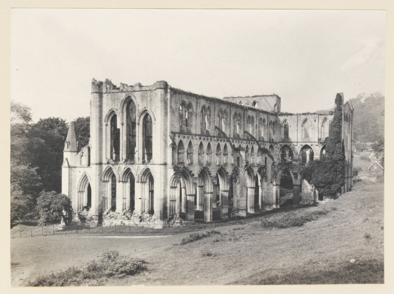 Rievaulx Abbey's roofless stone church ruins viewed from the south